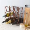Orwell 9 Bottle Iron & Leather Wine Rack -Entertainment Toy Store yellow octopus orwell 9 bottle wine rack 1